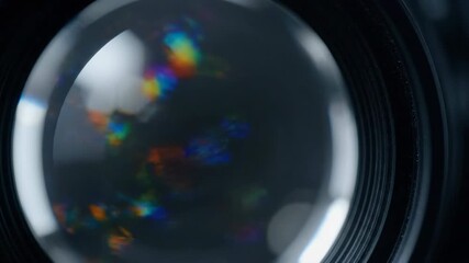 Wall Mural - abstract slow-motion shot of a rotating optical lens creating beautiful light refractions and intric