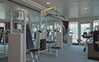 © Tamme Wichmann - Staying fit with cardio fitness equipment and treadmills in gym or fitness center on cruiseship or cruise ship liner