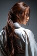 © Mrammon - A woman with long brown hair is wearing a white blouse and a long white skirt