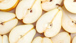 © Rixetons - Sliced pears arranged showing white flesh and seeds on white surface