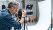 © Chineewan Somsap - Professional photographer captures images in studio setting, showcasing creativity and focus. backdrop is white, enhancing subject