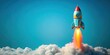 © chokdeelaw - toy rocket launching from cloud