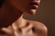 © lemonmoon - Smooth skin close up of female neck jawline and collarbone in warm light modern minimalist studio photo healthy complexion natural beauty serene mood