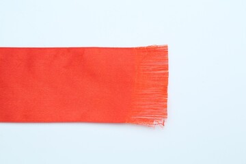 Wall Mural - Beautiful red ribbon on white background, top view. Space for text