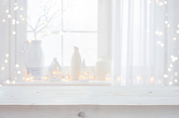 Wall Mural - Bleached wooden Christmas table top for your product presentation on blurred window festive interior decor background