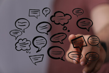 Conceptual communication background featuring hand pointing at message bubbles, symbolizing social media and digital interaction. Use for tech r