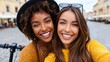 © Lubos Chlubny - Diverse women friends taking selfie during urban trip