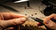 © Sulastri - Artisan creating delicate filigree jewelry with precision tools under focused light showcasing craftsmanship