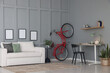© New Africa - Red bicycle and stylish furniture near grey wall indoors