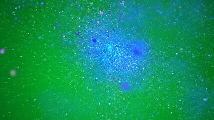 Wall Mural - Particles scattering outward in extreme slow motion, revealing intricate cosmic energy bursts on a green screen force, glimmer, special effect