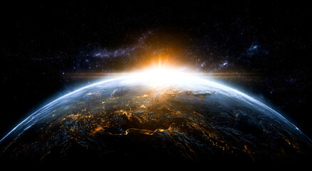 Wall Mural - A blue, glowing earth with the sun rising on it, against a dark background.