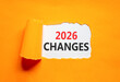 © Dzmitry - 2026 Changes symbol. Concept words 2026 Changes on beautiful white paper. Beautiful orange paper background. Business and 2026 changes concept. Copy space.