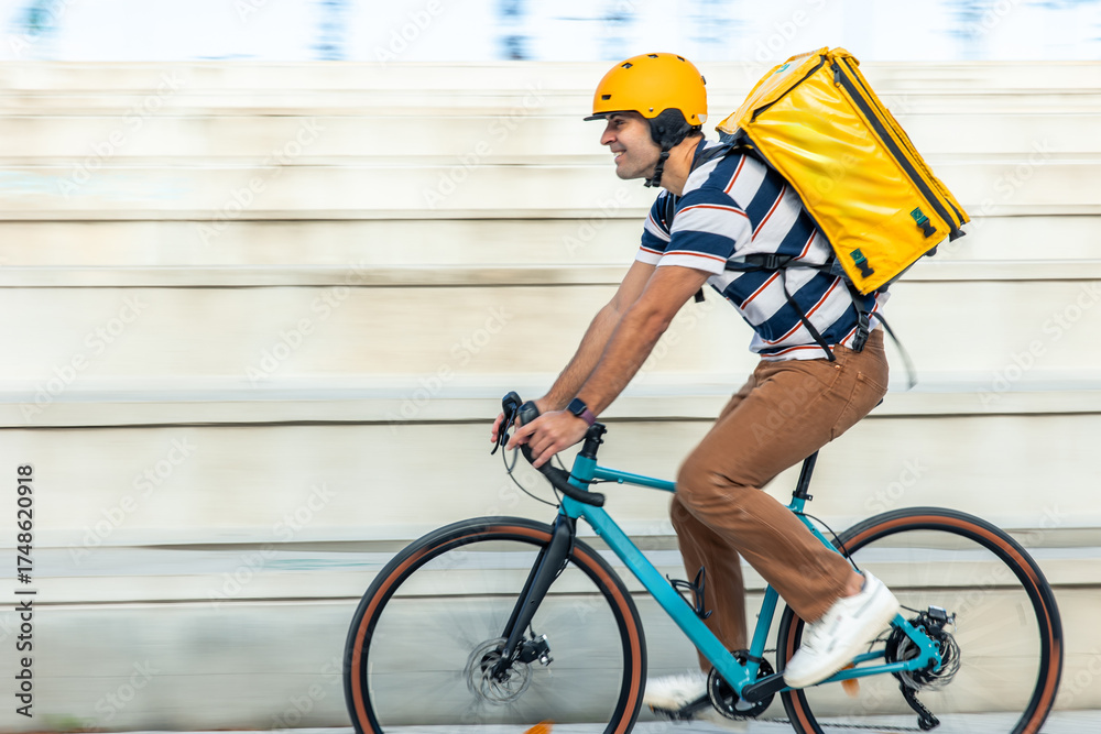 Hispanic Man Riding Bike blurred Hispanic delivery man riding bicycle delivering food fast Stock ...