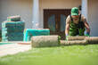 © Tomasz Zajda - Ground Preparation and Sod Installation in Residential Backyard Garden
