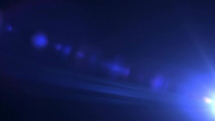 Sticker - dramatic cinematic lens flare effect sweeping across a dark, ethereal background with vibrant, atmos