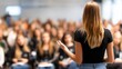 © Vitalii - Camera Facing Class: College Professor Gives a Lecture to a Classroom Full of Multi Ethnic Students. Talented Speaker Captures Audience Attention.