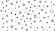 © Donalan - A captivating pattern of randomly scattered, simple star shapes, created with black lines on a white background.