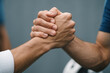 © Aleksandra - Two strong individuals engaging in an arm wrestling competition, close up of hands showing physical strength and determination
