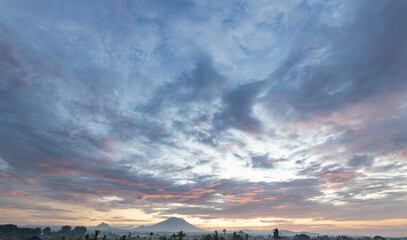 Wall Mural - Beautiful blue sky with a few clouds and a mountain in the background