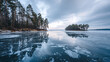 © Hathairat - Frozen lake with cracked ice reflection pine forest shore island silhouette overcast sky winter landscape cold atmosphere