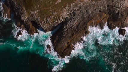 Wall Mural - Rocky Coastline Of Island Hit By Strong And Powerful Waves. - aerial shot
