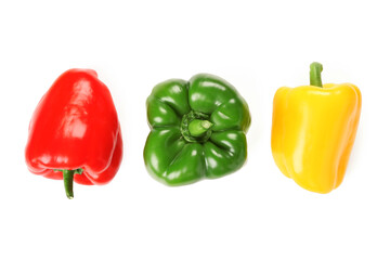 Wall Mural - Fresh colorful bell peppers on white background