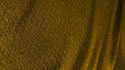 Abstract Golden Mesh Fabric Texture with Flowing Folds - Luxurious Shimmering Material Background