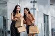 © crizzystudio - Happy friends enjoying shopping bags after successful purchase