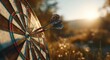© Vuvu - Close-up of a dartboard with two darts hitting the center bullseye, sunlit backdrop