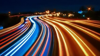 Wall Mural - City traffic leaving multicolored light trails at night