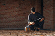 © standret - Builder is working on construction site, unfinished building