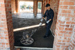 © standret - Holding the device for leveling the floor, concrete. Builder is working on construction site, unfinished building