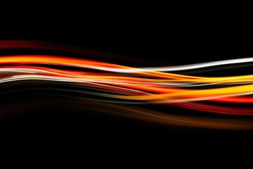 Wall Mural - Colorful light trails weave through darkness in an abstract display of movement and energy