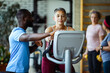 © Marko Geber - Senior woman exercising with trainer