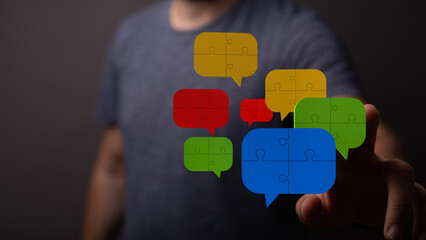 A person touching colorful digital speech bubbles. Symbolizes online communication, social media, and connected network discussions.