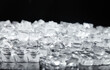© NgoThi - Clear Ice Cubes on Black Background for Beverage and Cooling Applications