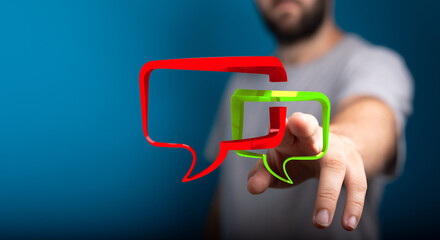 Man interacting with digital speech bubbles, ideal for demonstrating online communication and engagement, for stock image use.