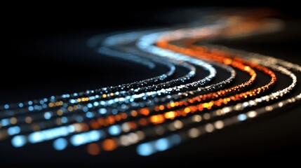 Wall Mural - Abstract light trails in motion showcasing vibrant colors of orange, blue, and white illuminating a dark background, creating a stunning visual effect
