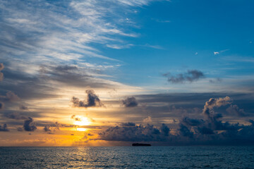 Wall Mural - Skyscape with sea sunrise. Peaceful horizon at sea nature. Romantic summer vacation on beach seascape. Sunrise sky horizon. Sea sunset view. Cloudy sunset sky and seascape at summer vacation