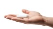 © danbila - Hand holding a white USB flash drive for data storage on a white background.
