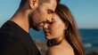 © Prime path 515 - Romantic moment of a young couple standing face to face at sunset by the ocean, sharing an intimate connection with warm natural light and soft wind
