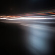 © PNG Studio - Dynamic light trails with motion blur on dark background, elongated white and yellow streaks suggesting speed and movement, isolated effect for abstract or artistic design projects.