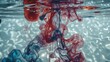 © Abdul - Vivid red and blue pigments disperse within clear water, creating stunning organic shapes and swirling patterns.