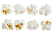 © Armin - Eight fluffy white popcorn kernels with golden yellow centers arranged in two rows against a black background