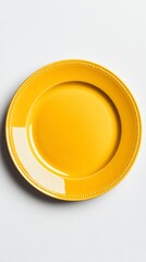 Wall Mural - An empty yellow plate with a white spot on a gray background — for culinary blogs, articles about tableware design, and kitchen accessory advertisements.