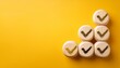 © Ashley - ubes with check mark on yellow background checklist concept with copy space
