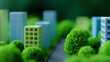 © kobkeroku - Miniature city model featuring green trees and small modern buildings with a blurred background, emphasizing urban planning and environmental integration