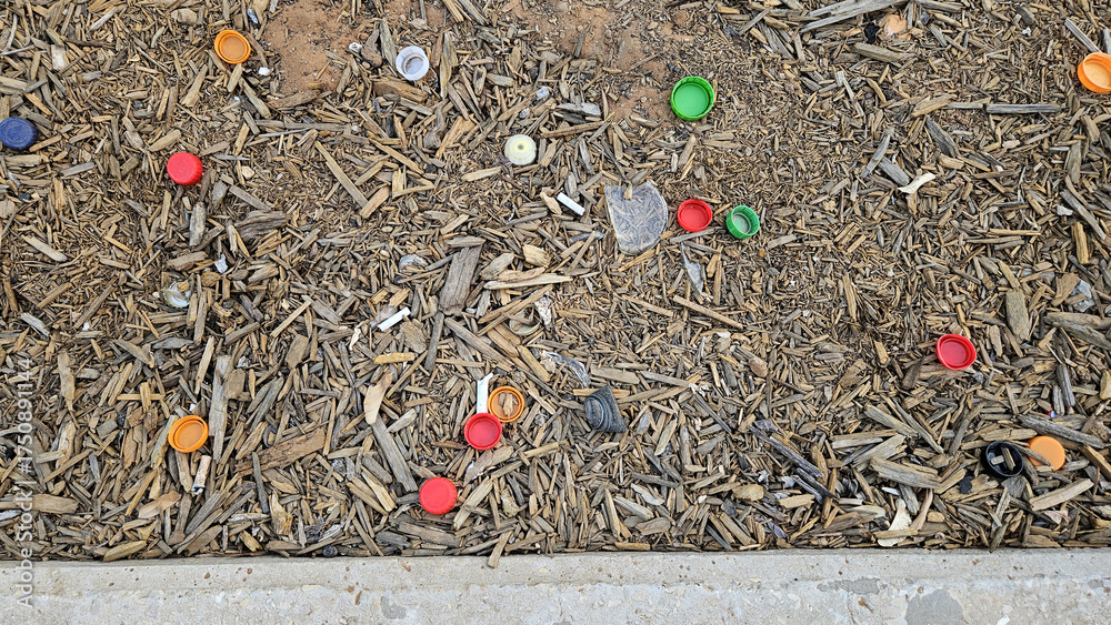 Colored garbage. Bottle caps and cigarette butts. Plastic pollution ...