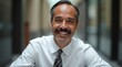 © Alex Pios - Smiling 45 years old banker, happy middle aged hispanic latino business man bank manager, mid adult professional businessman ceo executive in office