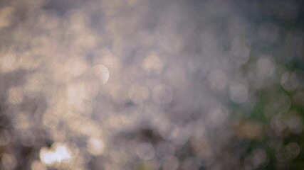 Gold colored blurry circle bokeh motion background.